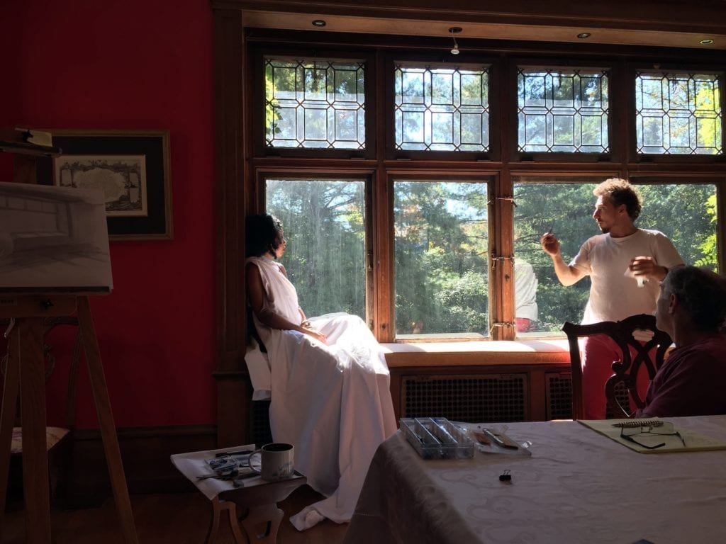 Chris painting and lecturing in the dining room